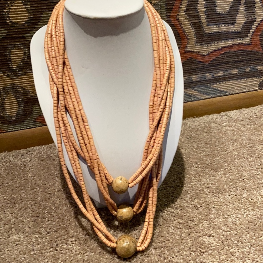 A 3 strand beaded necklace, w/three sphere stones